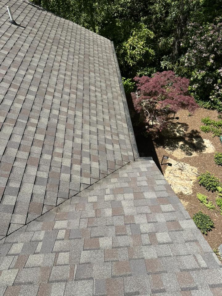Gray and brown asphalt shingle roof on a residential home